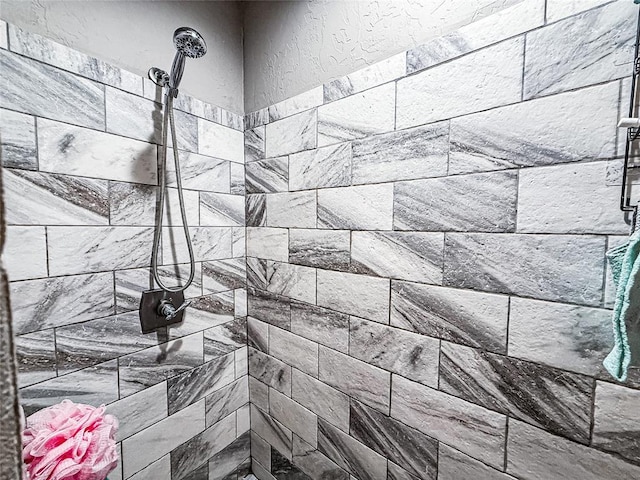 206 N Donald Ave, El Reno, OK 73036 - bathroom view of tiled shower and a textured wall