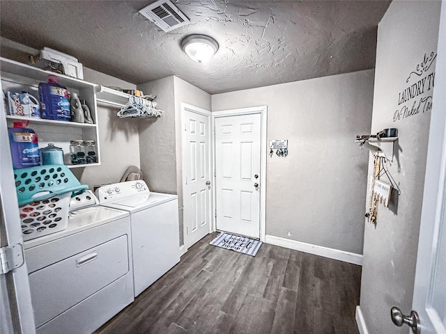 206 N Donald Ave, El Reno, OK 73036 - washroom with washing machine and dryer, dark wood finished floors, a textured ceiling, and baseboards