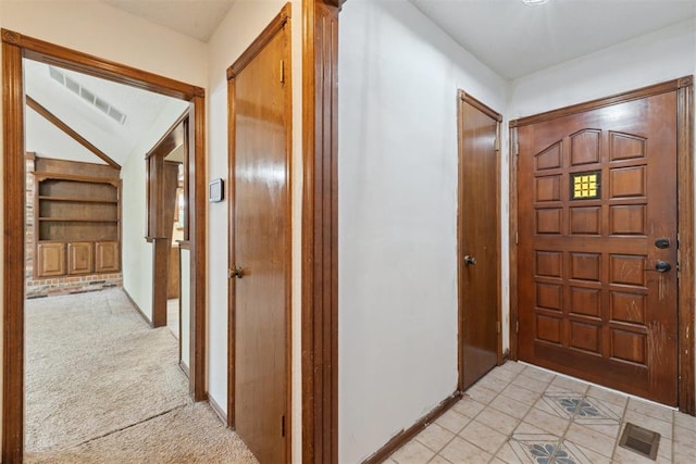 1104 Cedar Hill Pl, Oklahoma City, OK 73110 - entrance foyer featuring baseboards, light tile patterned floors, and light colored carpet