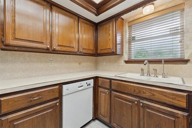 1104 Cedar Hill Pl, Oklahoma City, OK 73110 - kitchen with dishwasher, a sink, brown cabinetry, and light countertops