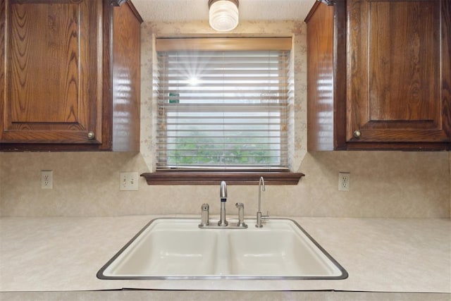 1104 Cedar Hill Pl, Oklahoma City, OK 73110 - kitchen with a sink, light countertops, and backsplash
