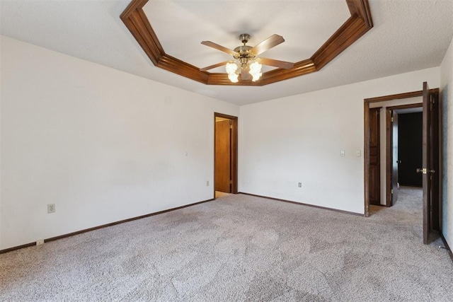 1104 Cedar Hill Pl, Oklahoma City, OK 73110 - unfurnished room featuring a tray ceiling, light carpet, a ceiling fan, and baseboards