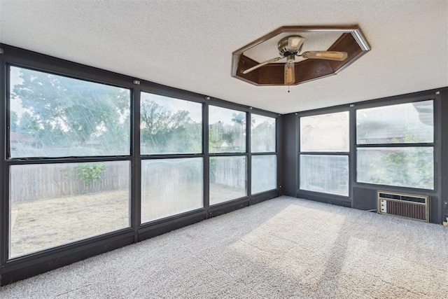 1104 Cedar Hill Pl, Oklahoma City, OK 73110 - unfurnished sunroom with carpet, a wall unit AC, and a textured ceiling