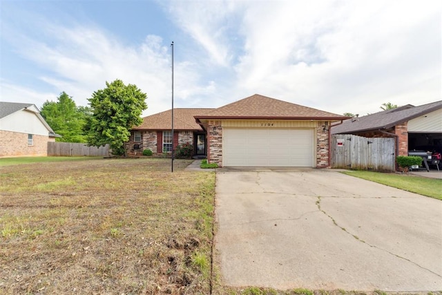 1104 Cedar Hill Pl, Oklahoma City, OK 73110 - ranch-style house with a garage, driveway, brick siding, and roof with shingles