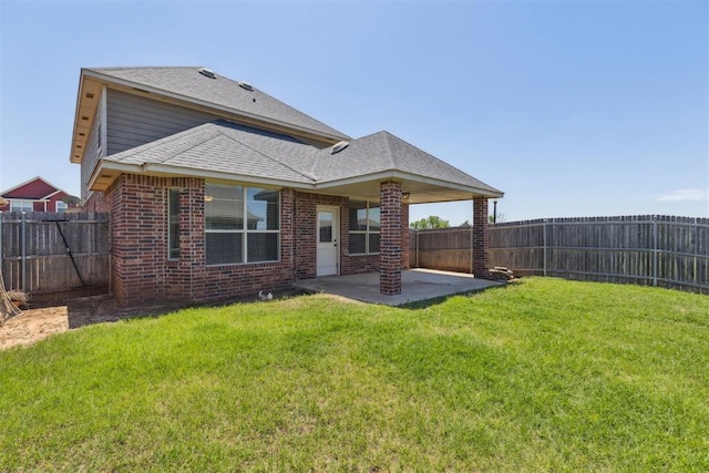 8345 NW 137th St, Oklahoma City, OK 73142 - back of property with a patio, brick siding, and roof with shingles