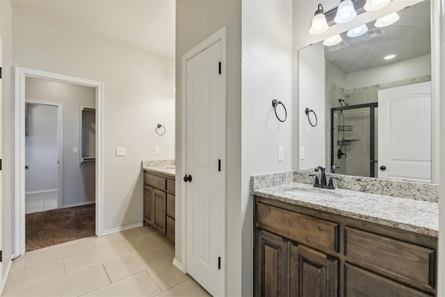 8345 NW 137th St, Oklahoma City, OK 73142 - bathroom featuring a stall shower, vanity, tile patterned flooring, and baseboards