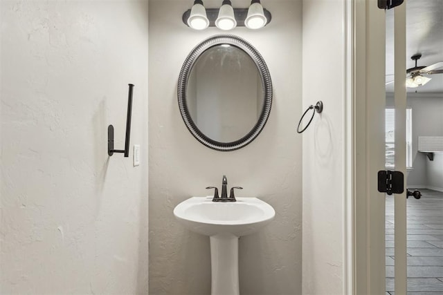 8345 NW 137th St, Oklahoma City, OK 73142 - bathroom with a textured wall and baseboards