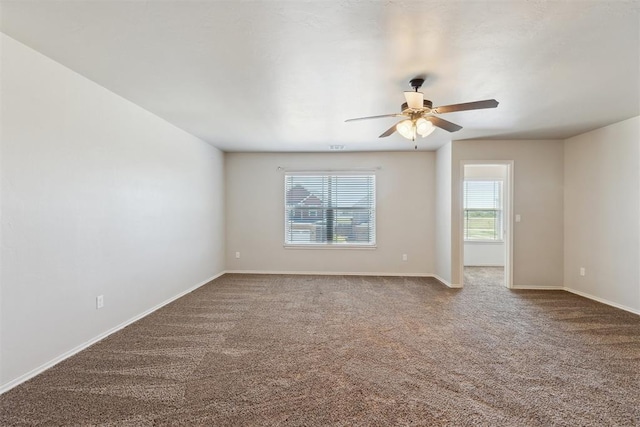 8345 NW 137th St, Oklahoma City, OK 73142 - carpeted empty room with a ceiling fan and baseboards