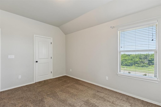 8345 NW 137th St, Oklahoma City, OK 73142 - unfurnished room with dark colored carpet, healthy amount of natural light, baseboards, and lofted ceiling