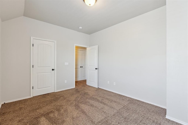 8345 NW 137th St, Oklahoma City, OK 73142 - unfurnished bedroom featuring carpet flooring, vaulted ceiling, and baseboards