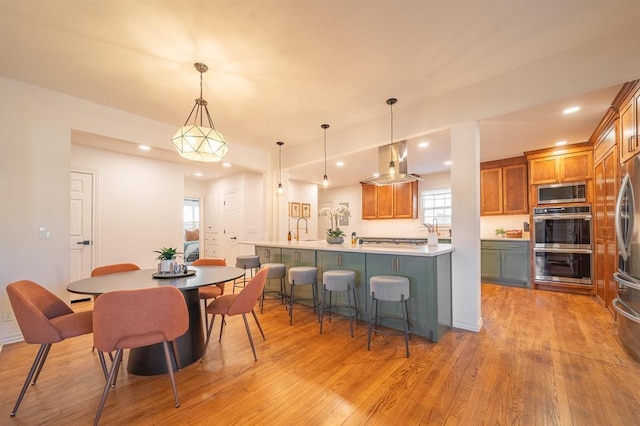 1017 Dean Pl, Oklahoma City, OK 73117 - dining space with light wood finished floors and recessed lighting