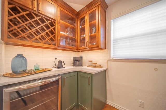 1017 Dean Pl, Oklahoma City, OK 73117 - indoor wet bar featuring wine cooler, tasteful backsplash, and baseboards