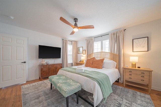 1017 Dean Pl, Oklahoma City, OK 73117 - bedroom featuring wood finished floors, ceiling fan, and baseboards