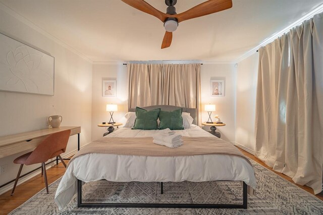 1017 Dean Pl, Oklahoma City, OK 73117 - bedroom featuring crown molding, wood finished floors, ceiling fan, and a desk