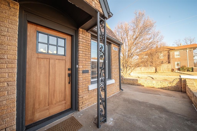 1017 Dean Pl, Oklahoma City, OK 73117 - doorway to property with brick siding and a patio