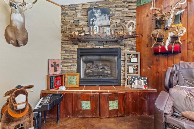 living room with finished concrete floors and a fireplace