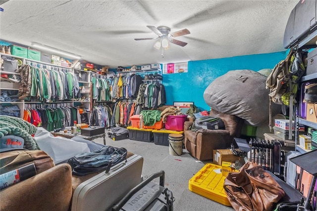 spacious closet with a ceiling fan and carpet flooring