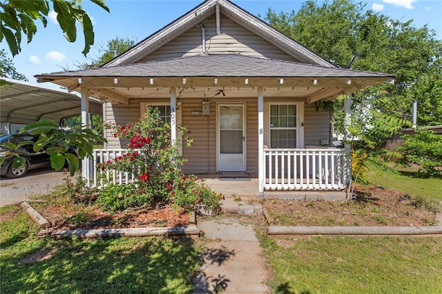 305 N Reimer, Corn, OK 73024 - view of front of house featuring covered porch and a detached carport