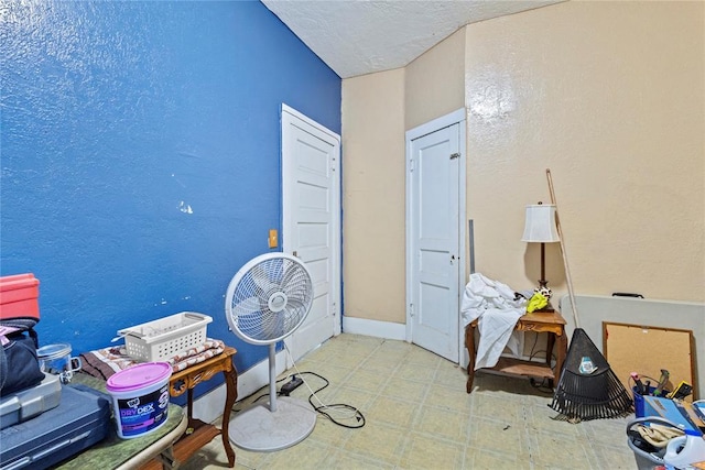 305 N Reimer, Corn, OK 73024 - bedroom with tile patterned floors, baseboards, and a textured wall