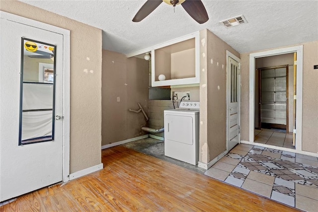 305 N Reimer, Corn, OK 73024 - clothes washing area with washer / dryer, a textured ceiling, baseboards, ceiling fan, and a textured wall