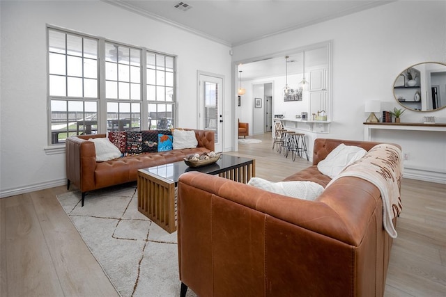 271 Taylam Rd, Goldsby, OK 73093 - living room with light wood finished floors, ornamental molding, and baseboards