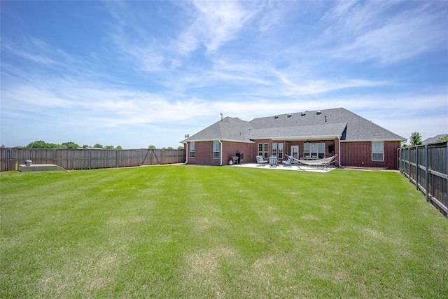 271 Taylam Rd, Goldsby, OK 73093 - rear view of house featuring a patio and brick siding