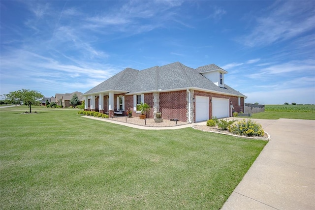 271 Taylam Rd, Goldsby, OK 73093 - view of front facade with brick siding, a garage, roof with shingles, a front lawn, and concrete driveway
