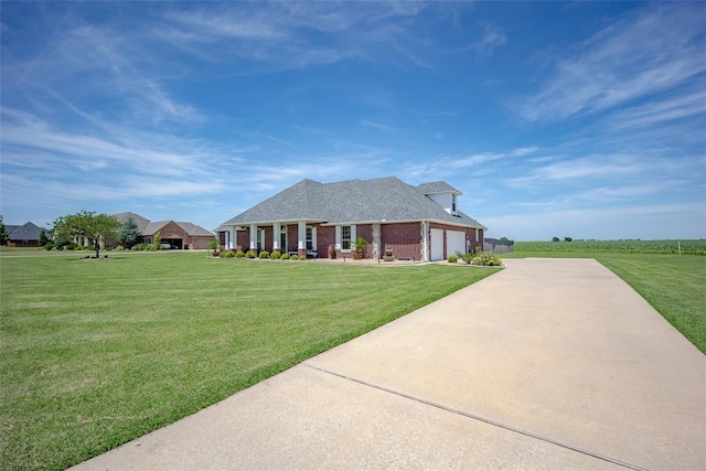 271 Taylam Rd, Goldsby, OK 73093 - single story home with an attached garage, concrete driveway, a front lawn, brick siding, and a shingled roof