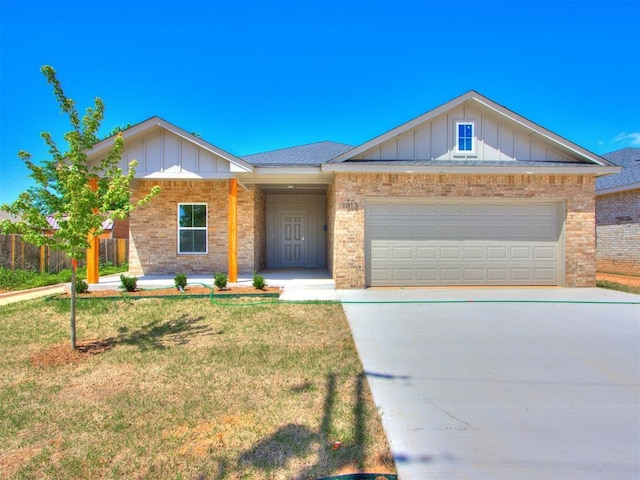 ranch-style house featuring brick siding, board and batten siding, driveway, and a garage