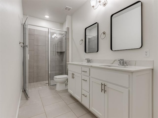 full bathroom featuring tile patterned floors, a shower stall, double vanity, toilet, and recessed lighting