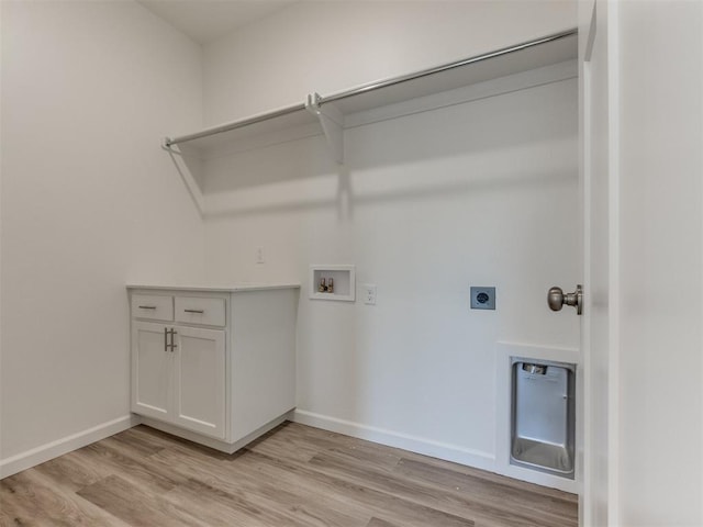 washroom with hookup for an electric dryer, light wood-style floors, washer hookup, and baseboards