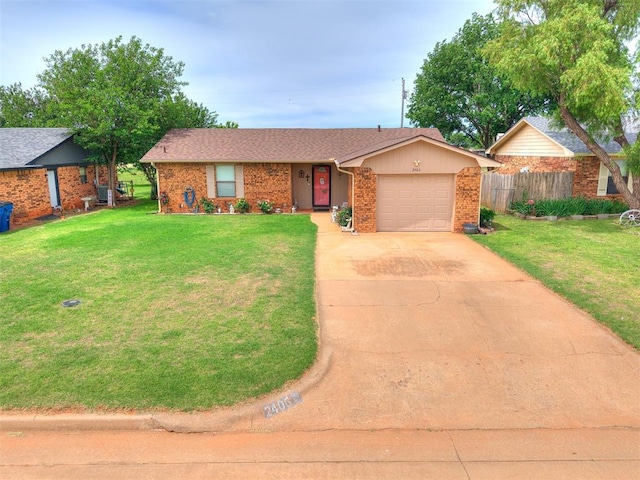 2406 S 15th St, Kingfisher, OK 73750 - ranch-style home featuring a garage, driveway, and brick siding