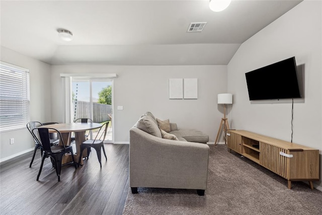 1837 Easton Ln, Oklahoma City, OK 73127 - living room featuring vaulted ceiling, baseboards, and dark wood-style flooring
