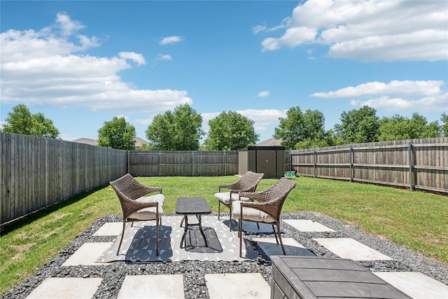 1837 Easton Ln, Oklahoma City, OK 73127 - view of patio with a storage unit and an outbuilding