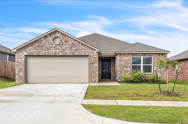 11700 NW 95th St, Yukon, OK 73099 - view of front of home featuring brick siding, an attached garage, driveway, and roof with shingles