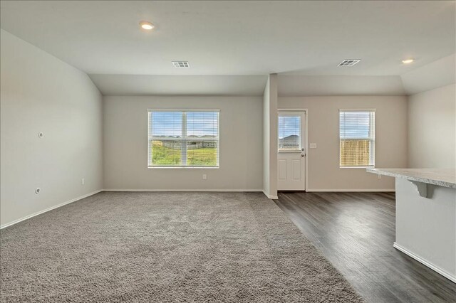 11700 NW 95th St, Yukon, OK 73099 - unfurnished living room with baseboards, dark wood-type flooring, and recessed lighting
