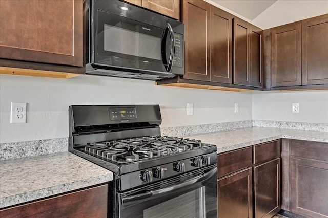 11700 NW 95th St, Yukon, OK 73099 - kitchen with black appliances, light countertops, and dark brown cabinetry