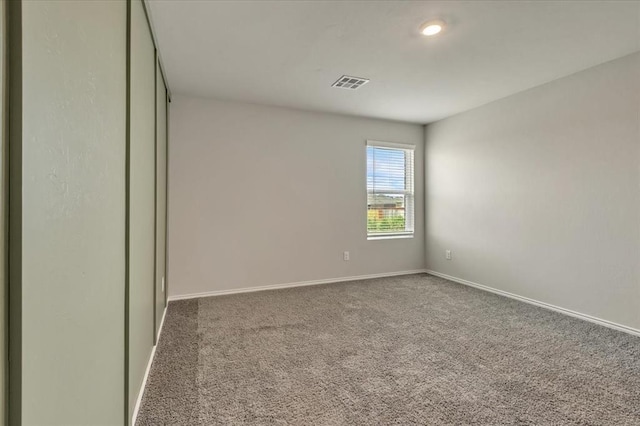 11700 NW 95th St, Yukon, OK 73099 - spare room with carpet flooring and baseboards