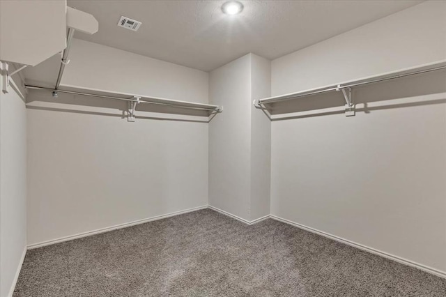 11700 NW 95th St, Yukon, OK 73099 - walk in closet featuring carpet flooring