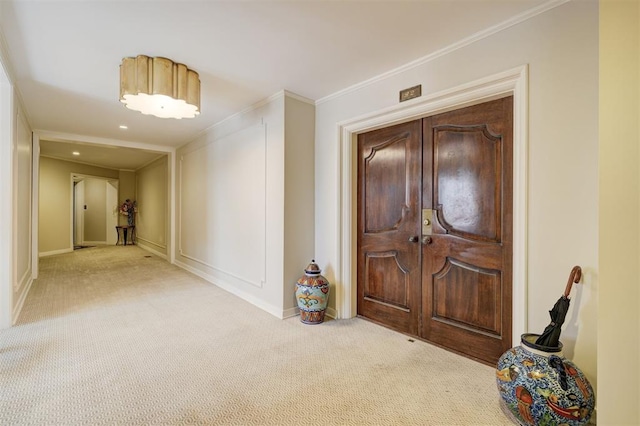 1114 Sherwood Ln Unit B-2, Nichols Hills, OK 73116 - carpeted entrance foyer featuring baseboards and ornamental molding