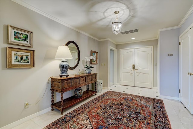 1114 Sherwood Ln Unit B-2, Nichols Hills, OK 73116 - foyer entrance featuring a chandelier, light tile patterned floors, crown molding, and baseboards