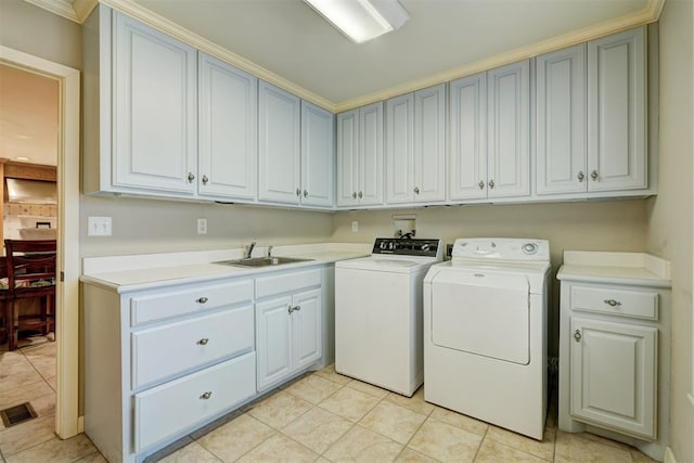 1114 Sherwood Ln Unit B-2, Nichols Hills, OK 73116 - clothes washing area featuring cabinet space, washing machine and dryer, and light tile patterned flooring