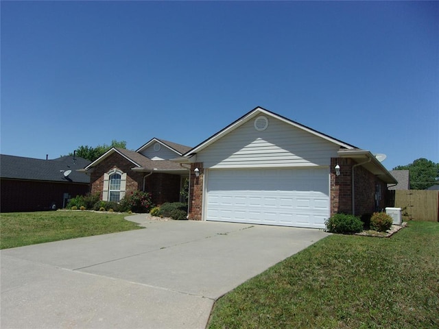 1926 E Aspen Pl, Shawnee, OK 74804 - ranch-style home featuring an attached garage, brick siding, concrete driveway, and central AC unit