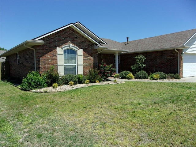 1926 E Aspen Pl, Shawnee, OK 74804 - ranch-style house featuring brick siding, a front lawn, and a garage