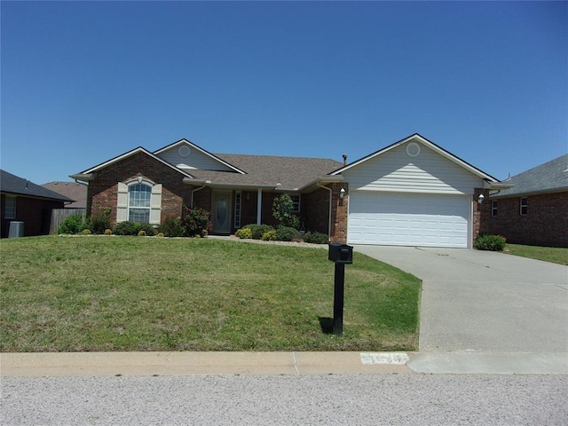 1926 E Aspen Pl, Shawnee, OK 74804 - ranch-style home with brick siding, an attached garage, driveway, and a front lawn