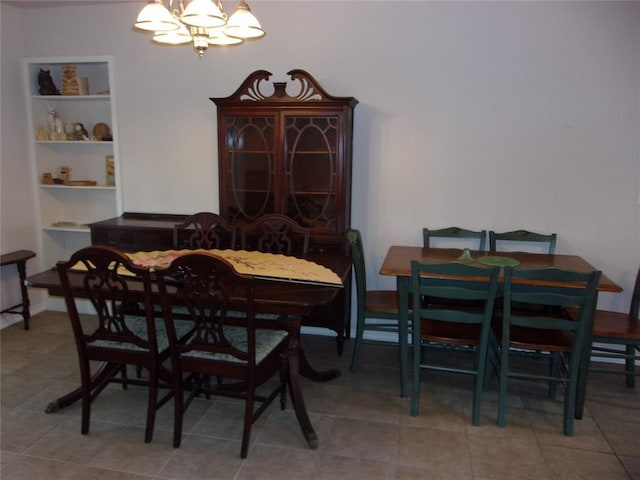 1926 E Aspen Pl, Shawnee, OK 74804 - dining space with a chandelier, built in shelves, and tile patterned floors