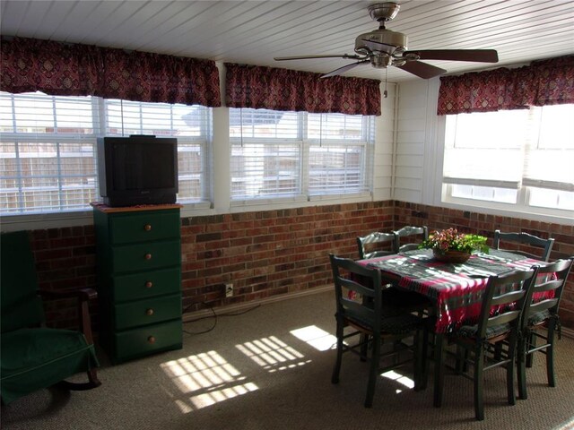 1926 E Aspen Pl, Shawnee, OK 74804 - dining room with ceiling fan, carpet, and brick wall