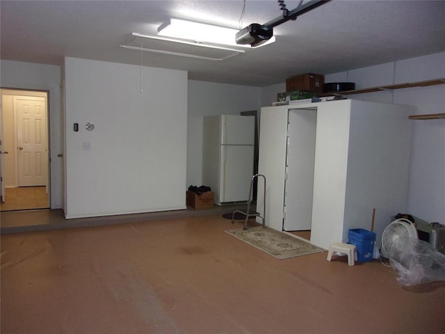 1926 E Aspen Pl, Shawnee, OK 74804 - garage featuring freestanding refrigerator and a garage door opener