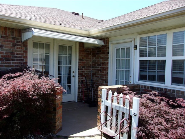 1926 E Aspen Pl, Shawnee, OK 74804 - property entrance featuring brick siding and roof with shingles