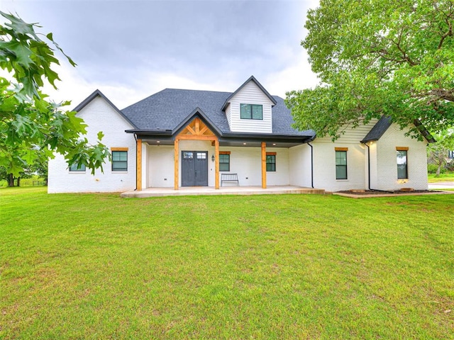 1614 S 1st Ave, Stroud, OK 74079 - modern farmhouse style home with a front yard, brick siding, and roof with shingles